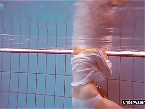 adorable red-haired plays naked underwater
