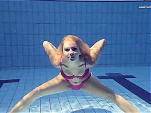 red-hot Elena showcases what she can do under water